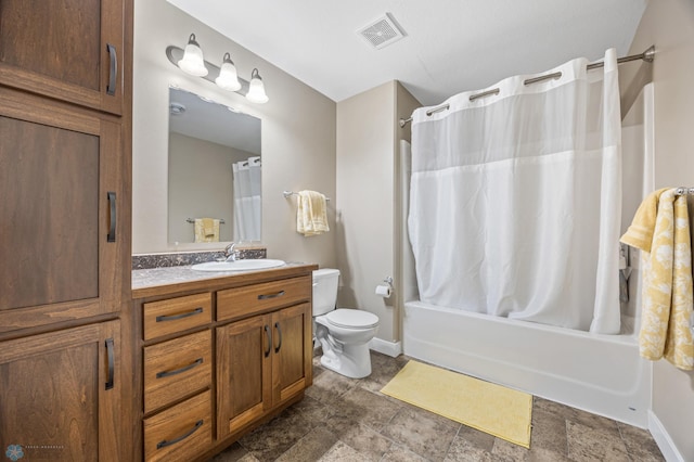 5409 47th Ave S, Fargo, ND 58104 - full bath featuring vanity, toilet, shower / tub combo with curtain, baseboards, and stone finish floors