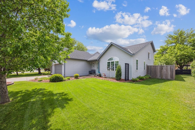 1435 104th Ln NW, Coon Rapids, MN 55433 - back of house featuring an attached garage, driveway, and roof with shingles