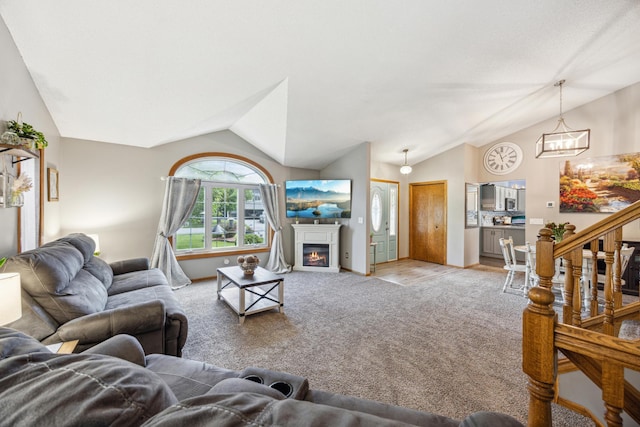 1435 104th Ln NW, Coon Rapids, MN 55433 - living room with vaulted ceiling, light colored carpet, a chandelier, a glass covered fireplace, and baseboards
