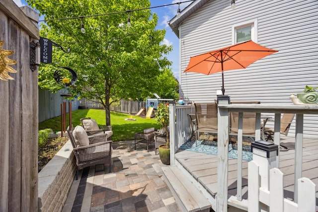 1435 104th Ln NW, Coon Rapids, MN 55433 - deck with a playground and a patio area