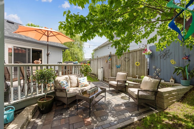1435 104th Ln NW, Coon Rapids, MN 55433 - fenced backyard with outdoor lounge area and a patio area