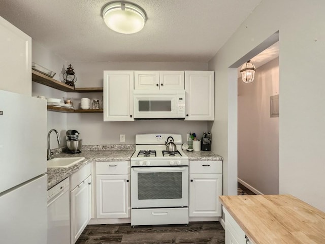 7354 72nd Ln N Unit 324, Brooklyn Park, MN 55428 - kitchen with white appliances, a sink, dark wood-style flooring, butcher block countertops, and white cabinets