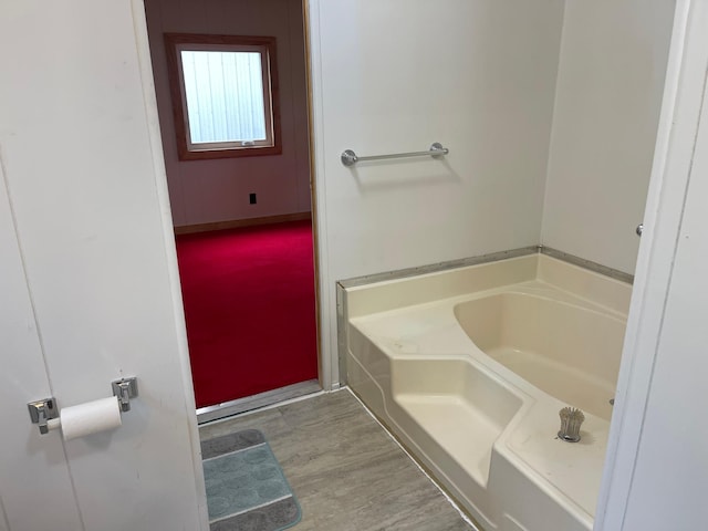 33008 Birch Ln, Motley, MN 56466 - full bath featuring a garden tub and wood finished floors