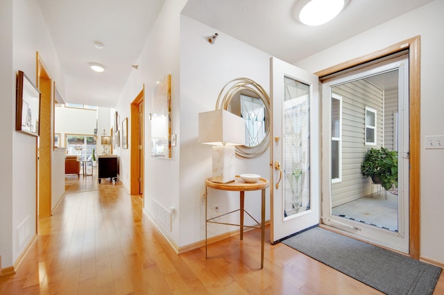 10014 Cove Dr, Hopkins, MN 55305 - entryway with light wood finished floors and baseboards