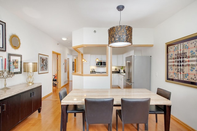 10014 Cove Dr, Hopkins, MN 55305 - dining room featuring light wood finished floors and baseboards