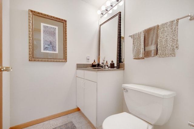 10014 Cove Dr, Hopkins, MN 55305 - bathroom featuring toilet, baseboards, and vanity