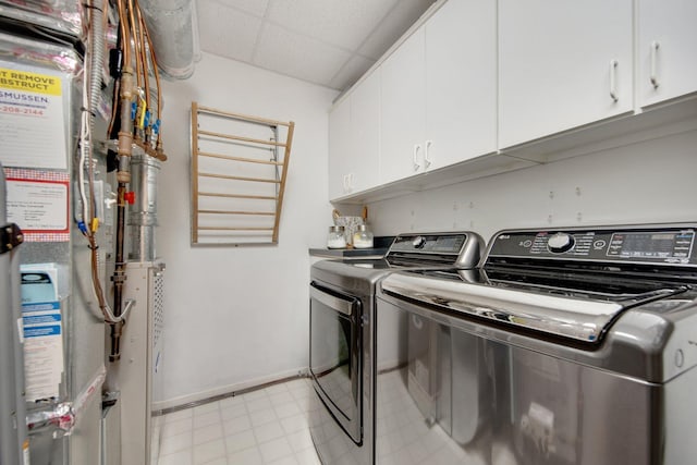 10014 Cove Dr, Hopkins, MN 55305 - laundry area with cabinet space, independent washer and dryer, and baseboards