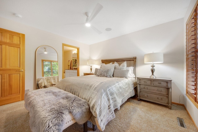 10014 Cove Dr, Hopkins, MN 55305 - bedroom with light colored carpet, a ceiling fan, rail lighting, connected bathroom, and baseboards