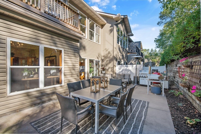 10014 Cove Dr, Hopkins, MN 55305 - view of patio / terrace featuring outdoor dining area and a balcony