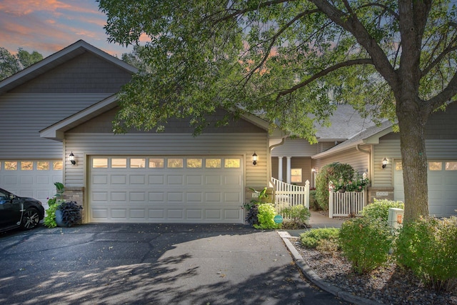 10014 Cove Dr, Hopkins, MN 55305 - view of front of home with driveway and an attached garage