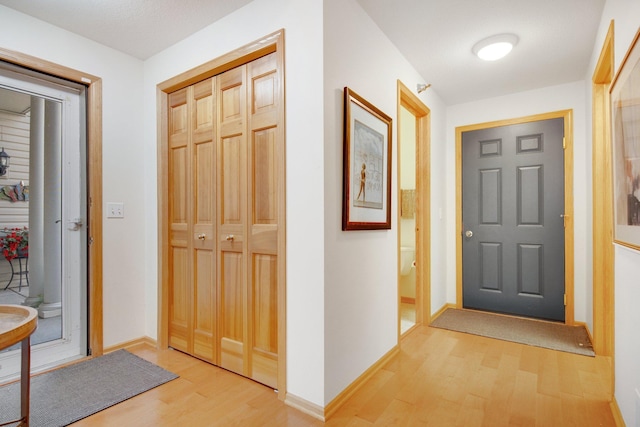 10014 Cove Dr, Hopkins, MN 55305 - foyer with light wood finished floors and baseboards