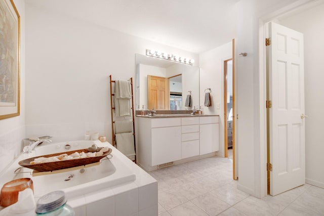 10014 Cove Dr, Hopkins, MN 55305 - bathroom with a tub with jets and vanity