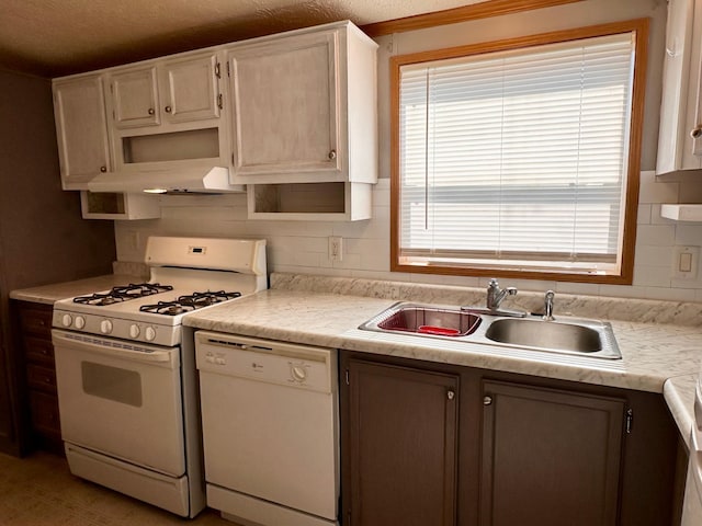 33363 Gardenview Dr, Sturgeon Lake, MN 55783 - kitchen featuring white appliances, a sink, under cabinet range hood, light countertops, and backsplash