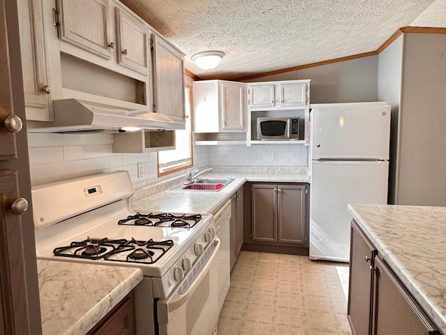 33363 Gardenview Dr, Sturgeon Lake, MN 55783 - kitchen featuring white appliances, a sink, crown molding, under cabinet range hood, and tasteful backsplash