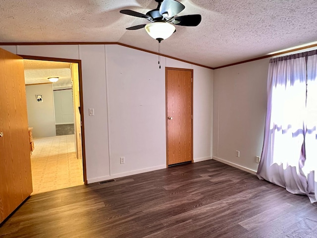 33363 Gardenview Dr, Sturgeon Lake, MN 55783 - spare room featuring wood finished floors, vaulted ceiling, ornamental molding, ceiling fan, and a textured ceiling