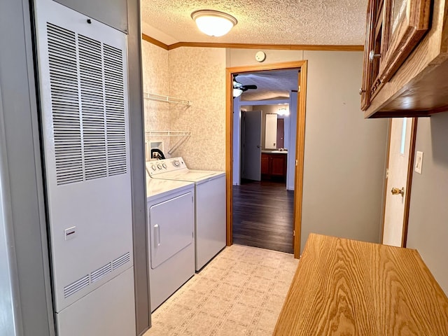 33363 Gardenview Dr, Sturgeon Lake, MN 55783 - washroom featuring a heating unit, ornamental molding, a textured ceiling, cabinet space, and independent washer and dryer