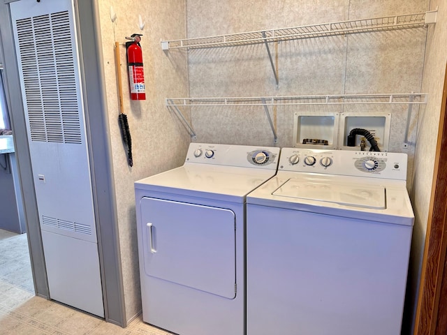 33363 Gardenview Dr, Sturgeon Lake, MN 55783 - laundry area with a heating unit and washing machine and clothes dryer