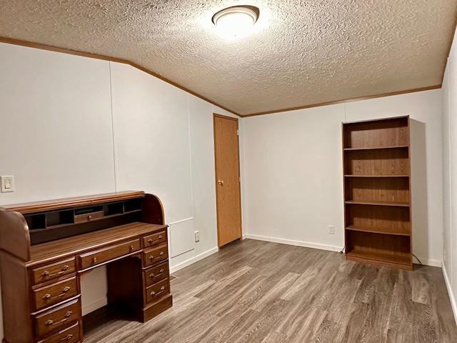 33363 Gardenview Dr, Sturgeon Lake, MN 55783 - unfurnished office with wood finished floors, a textured ceiling, lofted ceiling, and baseboards