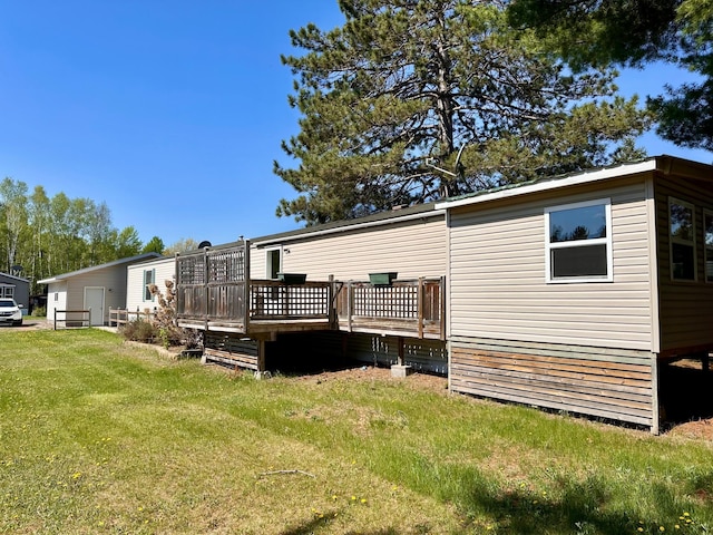 33363 Gardenview Dr, Sturgeon Lake, MN 55783 - back of house with a wooden deck and a yard