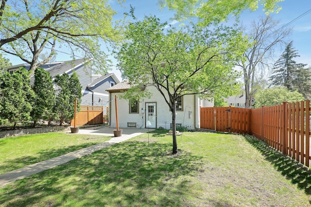 view of yard with a patio area and a gate
