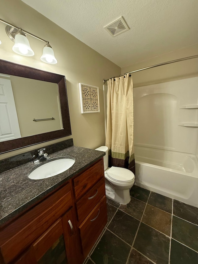 4681 Heritage Pkwy N, Hugo, MN 55038 - bathroom featuring vanity, shower / bath combo, toilet, a textured ceiling, and tile patterned floors