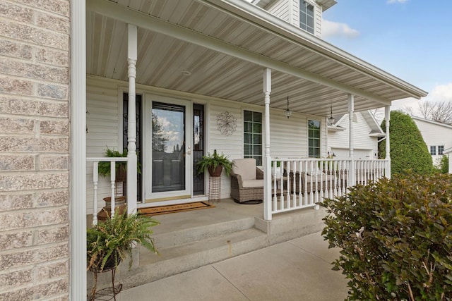 view of exterior entry with a porch