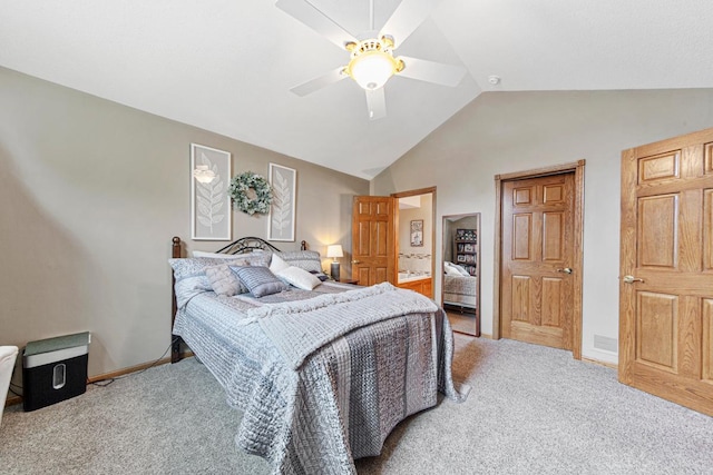 bedroom with carpet floors, lofted ceiling, baseboards, and ceiling fan