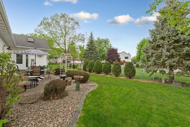 view of yard with a patio and stairs