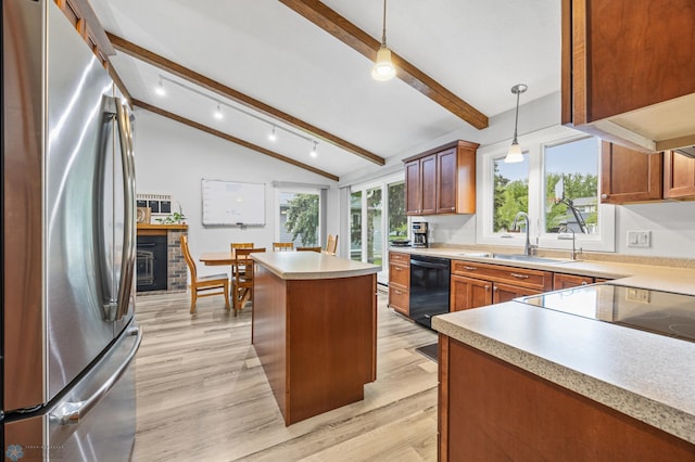 2514 Willow Rd N, Fargo, ND 58102 - kitchen featuring freestanding refrigerator, a sink, dishwasher, light wood-type flooring, and a kitchen island