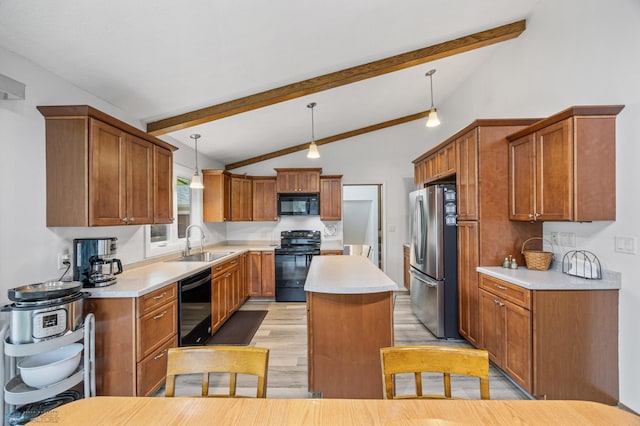 2514 Willow Rd N, Fargo, ND 58102 - kitchen with black appliances, a sink, a center island, light wood-type flooring, and light countertops