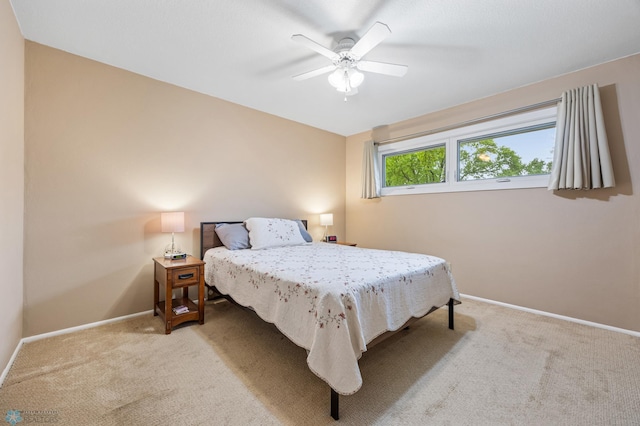 2514 Willow Rd N, Fargo, ND 58102 - carpeted bedroom with baseboards and a ceiling fan