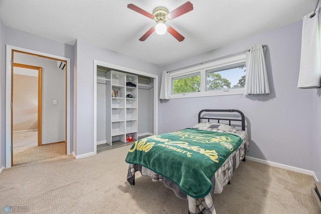 2514 Willow Rd N, Fargo, ND 58102 - bedroom featuring baseboards, carpet floors, a closet, and ceiling fan
