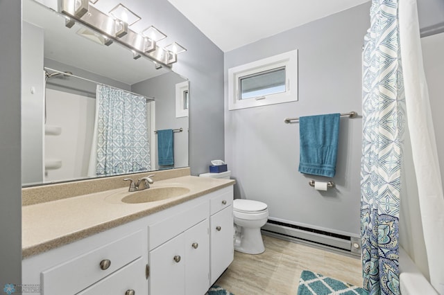 2514 Willow Rd N, Fargo, ND 58102 - bathroom featuring a baseboard radiator, vanity, toilet, shower / tub combo, and wood finished floors
