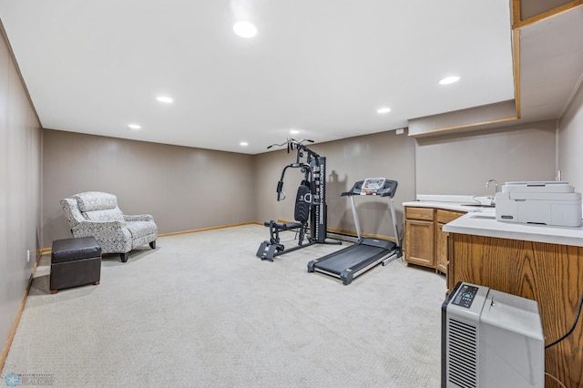 2514 Willow Rd N, Fargo, ND 58102 - exercise area featuring light colored carpet, baseboards, recessed lighting, and a sink