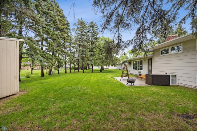 2514 Willow Rd N, Fargo, ND 58102 - view of green lawn with an outdoor fire pit