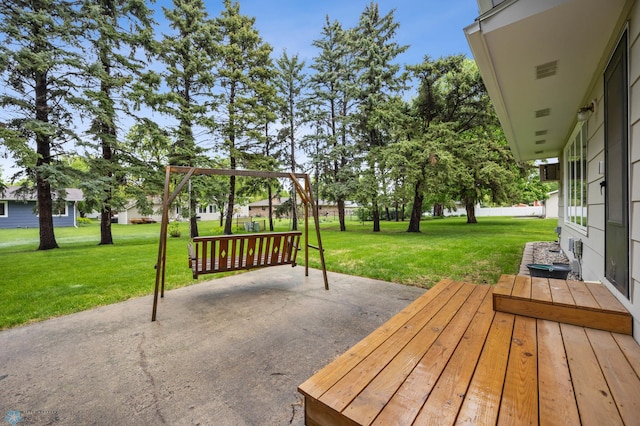 2514 Willow Rd N, Fargo, ND 58102 - wooden terrace featuring a patio and a yard