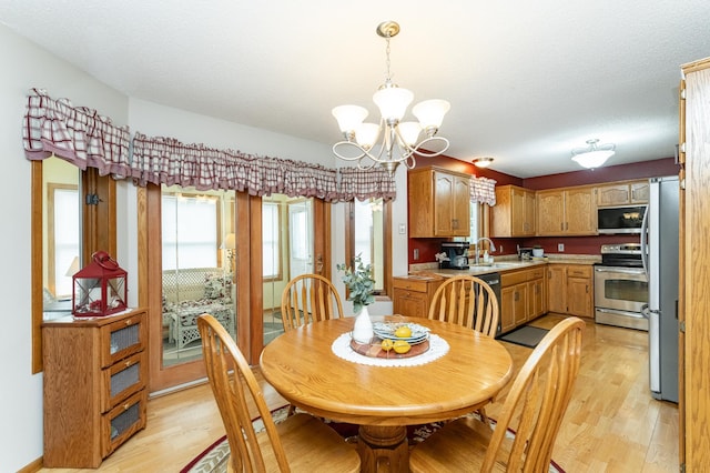 4822 3rd St NW, Rochester, MN 55901 - dining room featuring light wood-style floors and a chandelier