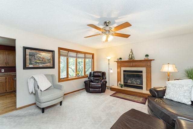 4822 3rd St NW, Rochester, MN 55901 - living room featuring a premium fireplace, baseboards, light carpet, and ceiling fan