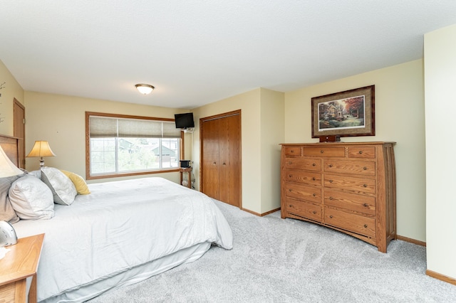 4822 3rd St NW, Rochester, MN 55901 - bedroom with carpet flooring, a closet, and baseboards