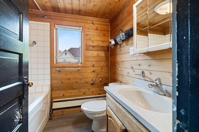 301 3rd St, Nashwauk, MN 55769 - bathroom with wood ceiling, toilet, a baseboard heating unit, vanity, and wood finished floors