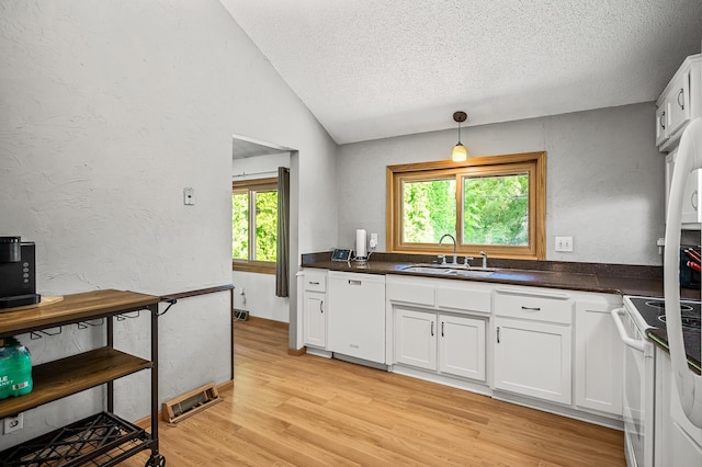 1653 Briardale Rd NE, Fridley, MN 55432 - kitchen with a sink, white appliances, a textured ceiling, light wood-style flooring, and dark countertops