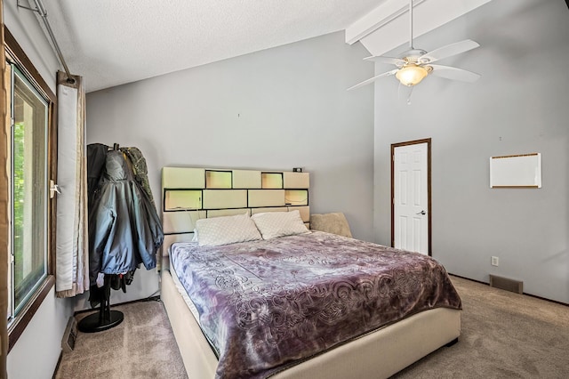 1653 Briardale Rd NE, Fridley, MN 55432 - bedroom featuring carpet flooring, vaulted ceiling, a textured ceiling, baseboards, and ceiling fan