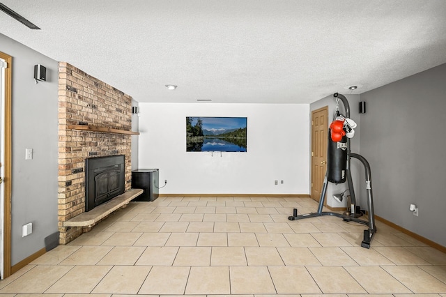 1653 Briardale Rd NE, Fridley, MN 55432 - exercise area featuring a textured ceiling, a fireplace, and baseboards