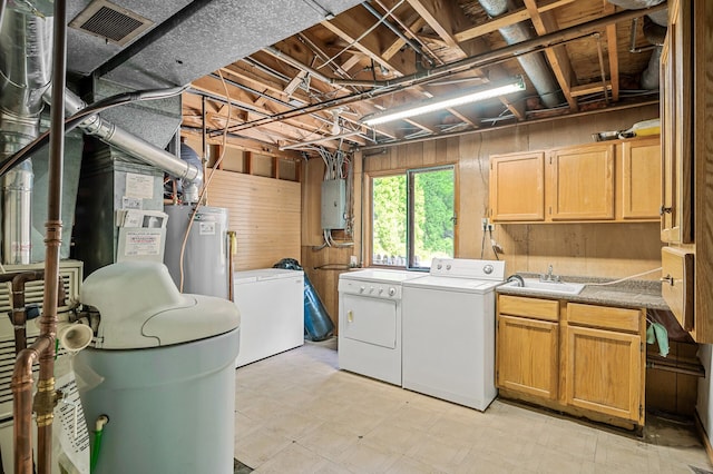 1653 Briardale Rd NE, Fridley, MN 55432 - laundry room with independent washer and dryer, cabinet space, electric panel, light floors, and wooden walls