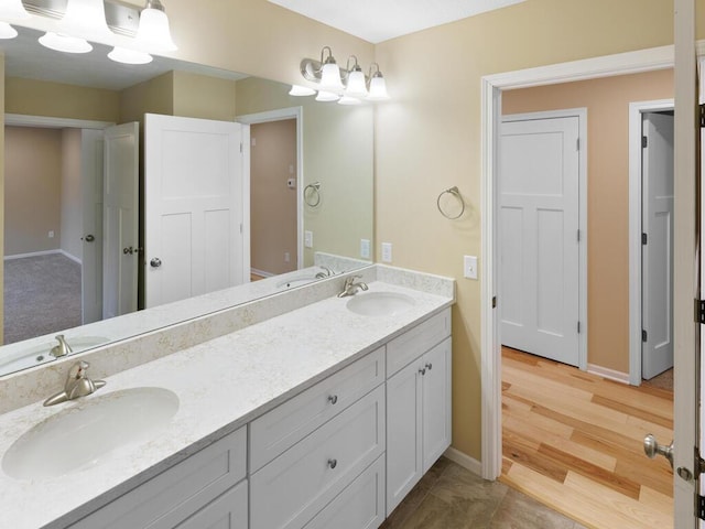 17394 Sunset Trl SW, Prior Lake, MN 55372 - full bathroom with double vanity and baseboards