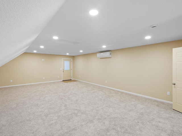 17394 Sunset Trl SW, Prior Lake, MN 55372 - finished below grade area with a wall mounted AC, recessed lighting, carpet flooring, and baseboards