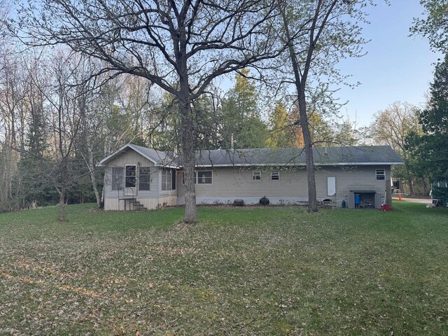 54202 Memory Ln NE, Waskish, MN 56685 - rear view of house with a lawn