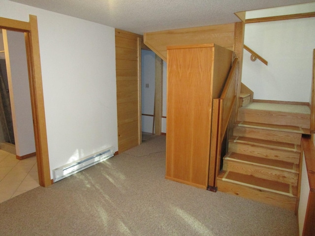 50532 County 29, Bemidji, MN 56601 - staircase with a baseboard radiator, carpet floors, a textured ceiling, and wooden walls