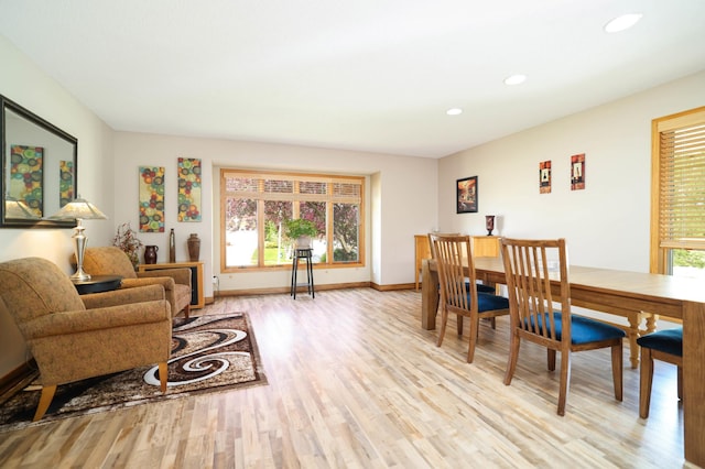 dining room featuring light wood-style flooring, recessed lighting, and baseboards