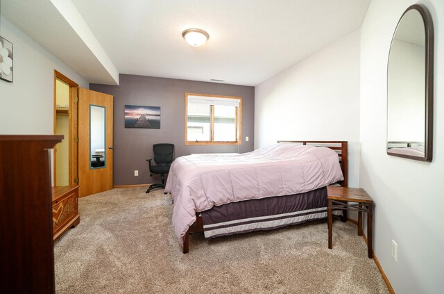 carpeted bedroom with baseboards